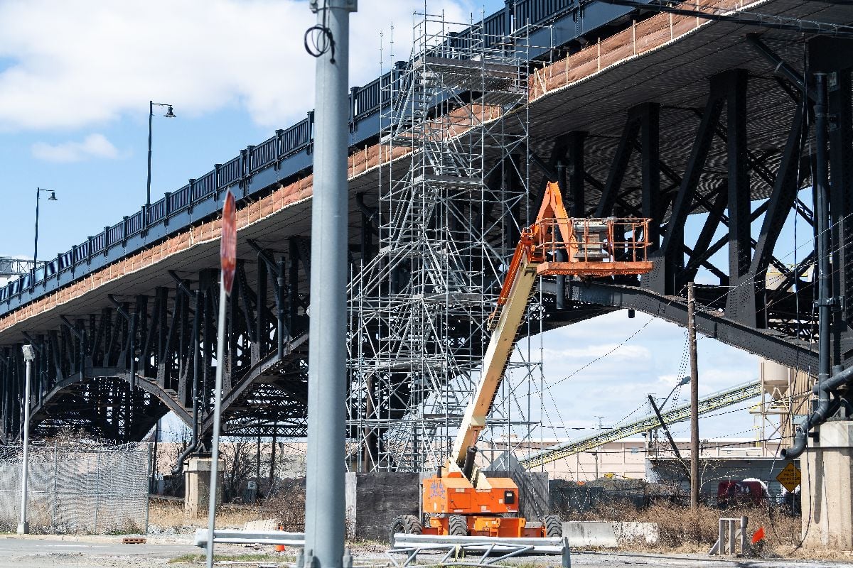 Industrial view in downtown city area in New Jersey with construction on bridge.