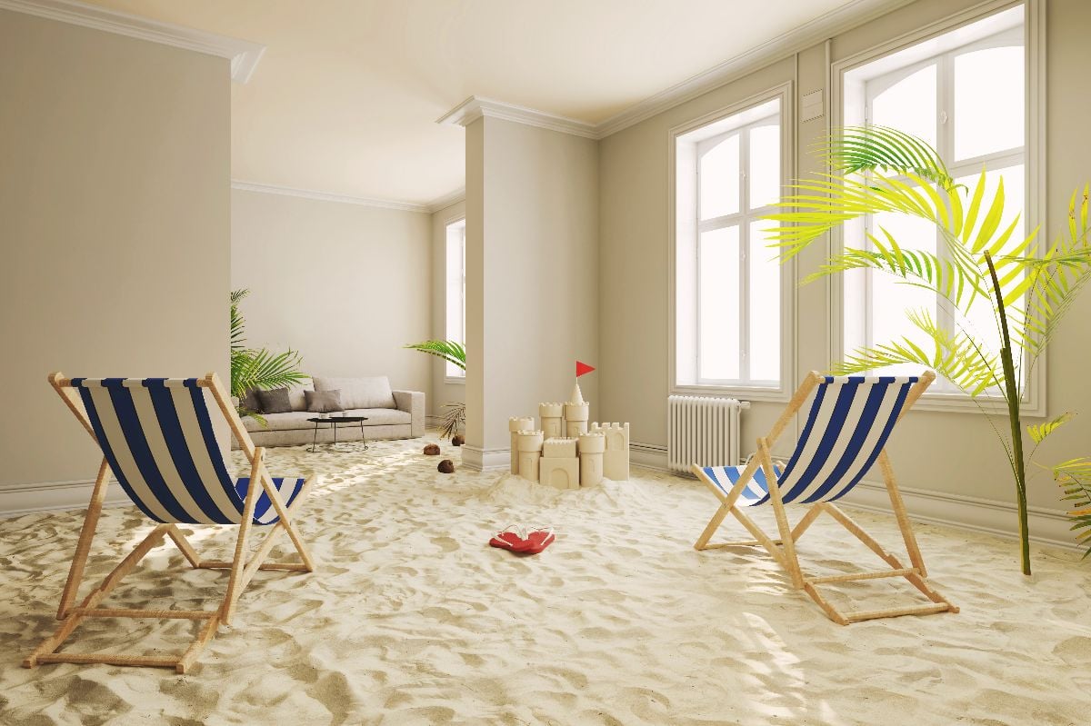 Living room covered in sand.