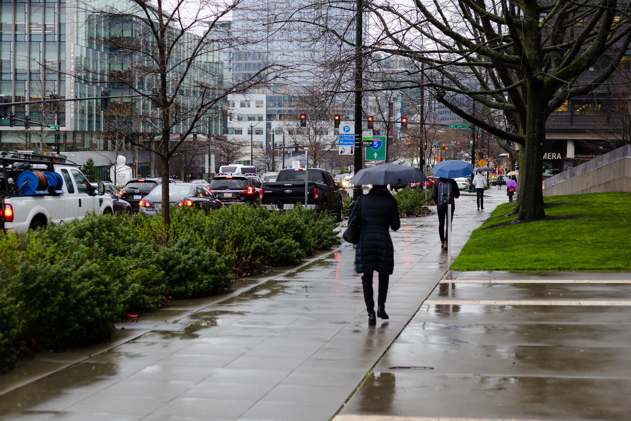 People walking in the rain going to work.