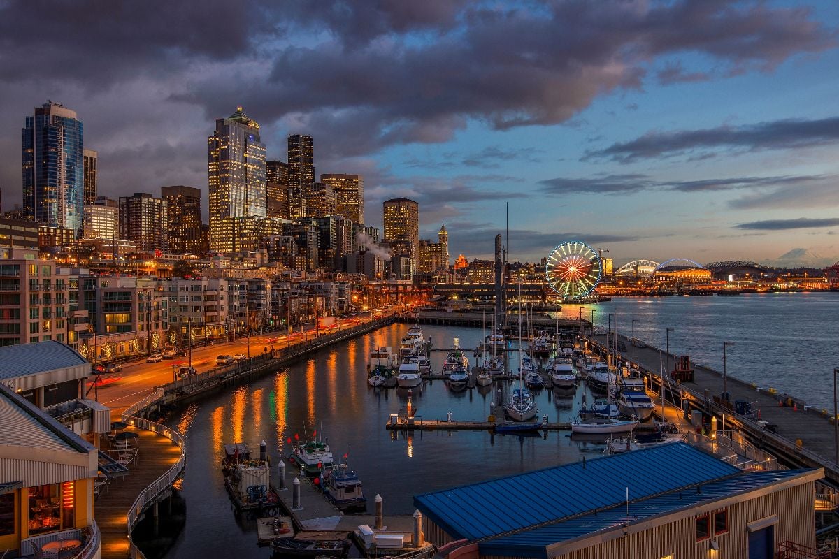 Seattle waterfront and downtown skyline at dusk.