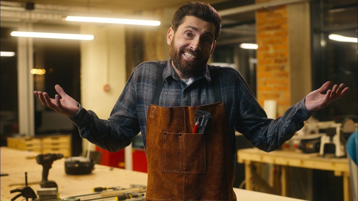 Wood master man shrugging shoulders.