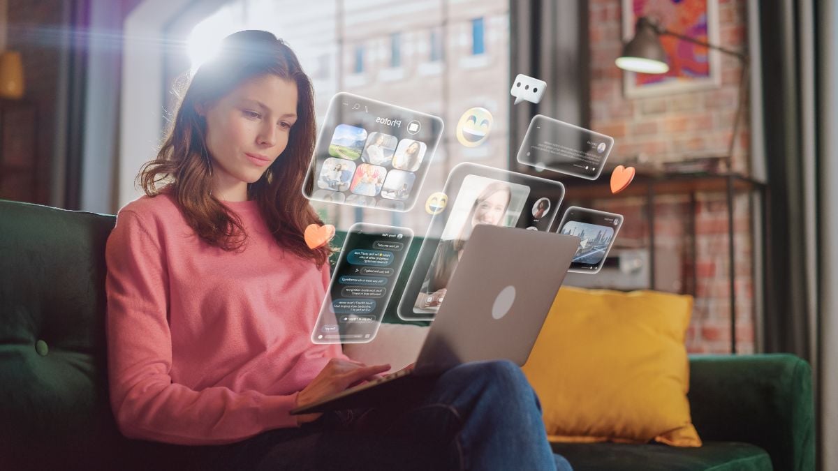 Woman checking social media apps on laptop.