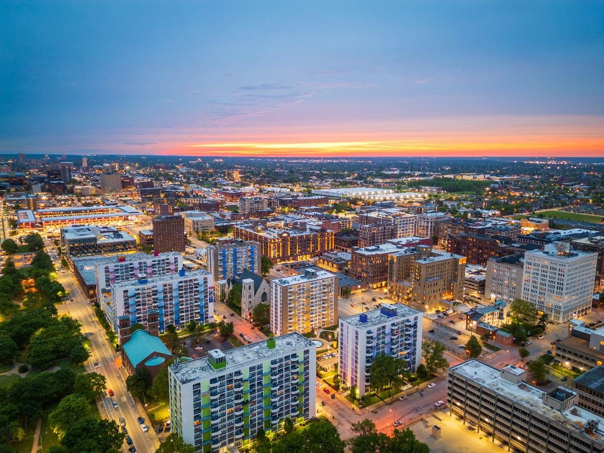 Downtown city apartment blocks at dusk.