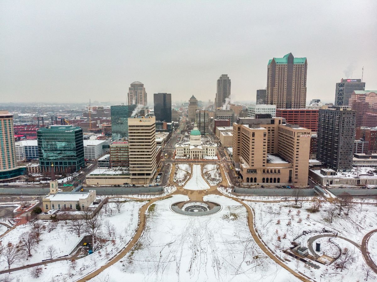 Aerial view of a city downtown covered in snow.
