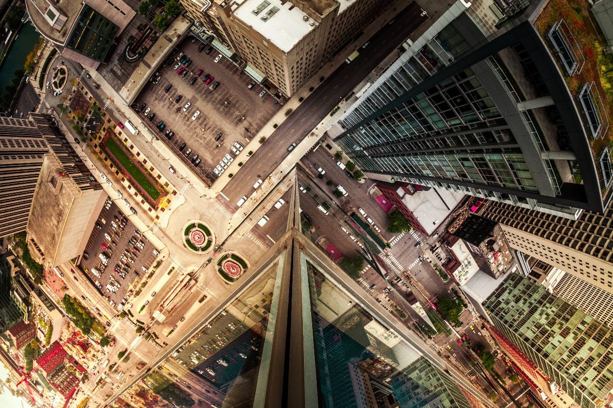 Wide angle looking down at traffic intersection.