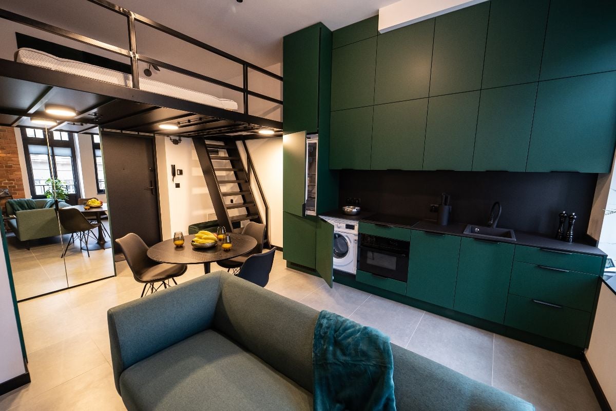 Modern studio apartment with a mezzanine bedroom. 
