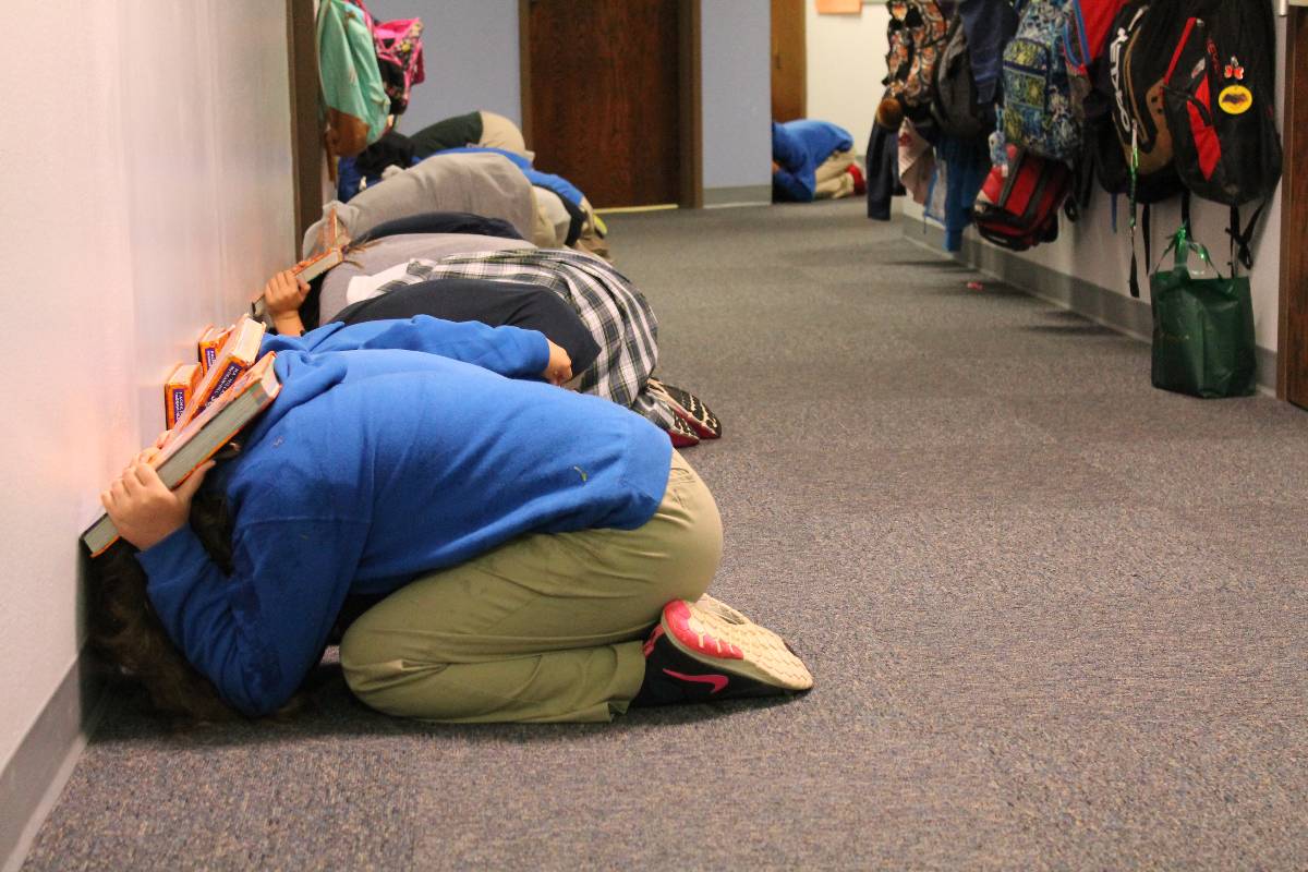Students practicing tornado drill.