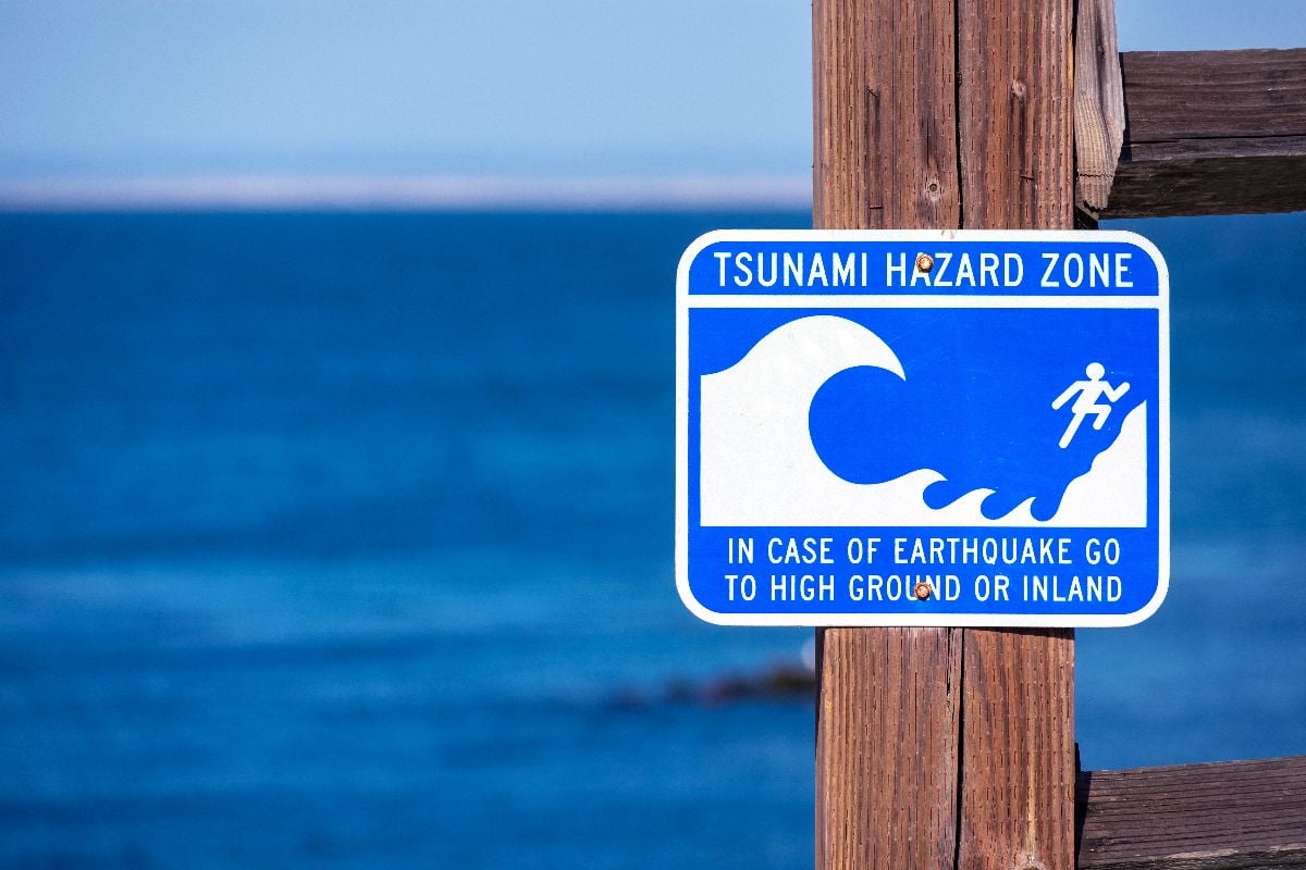 Tsunami Hazard Zone warning sign on the Pacific Ocean coast.