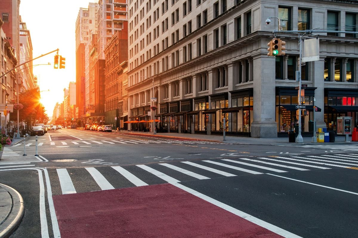 Empty cityscape with no people at the intersection.