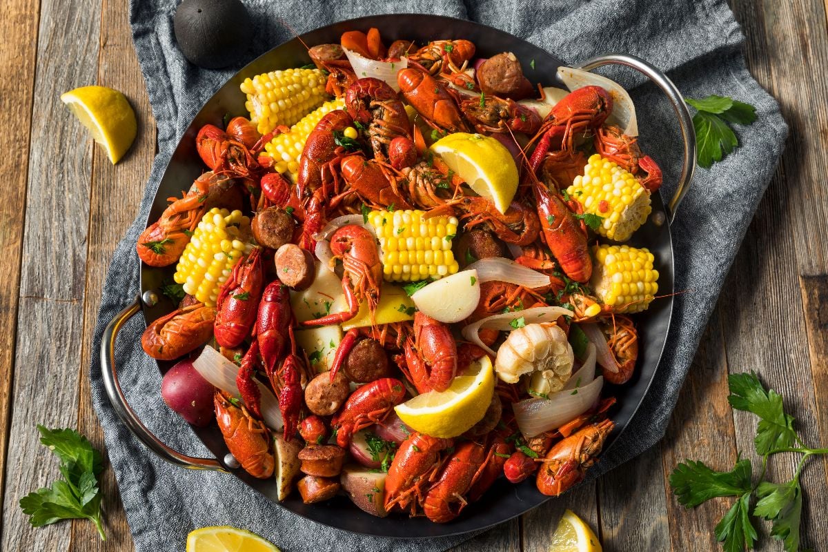 Homemade Southern crawfish boil with potatoes sausage and corn.