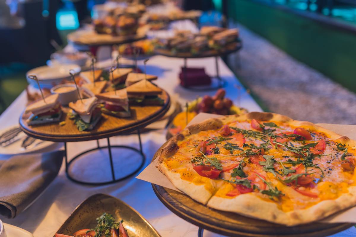 Buffet table for a banquet, sandwich and pizza.