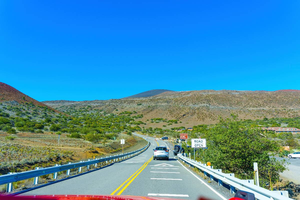 Mauna Kea landscape with the winding road and the exit to the visitors station.