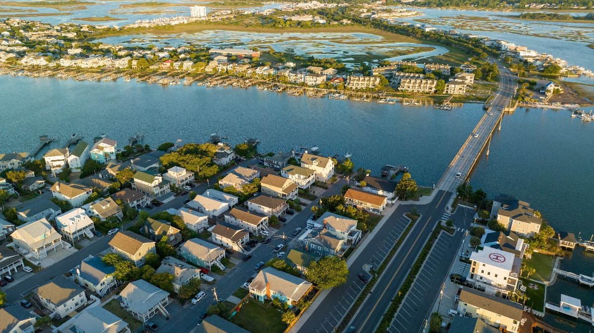 Aerial view of Wrightsville Beach, NC homes during a sunrise.