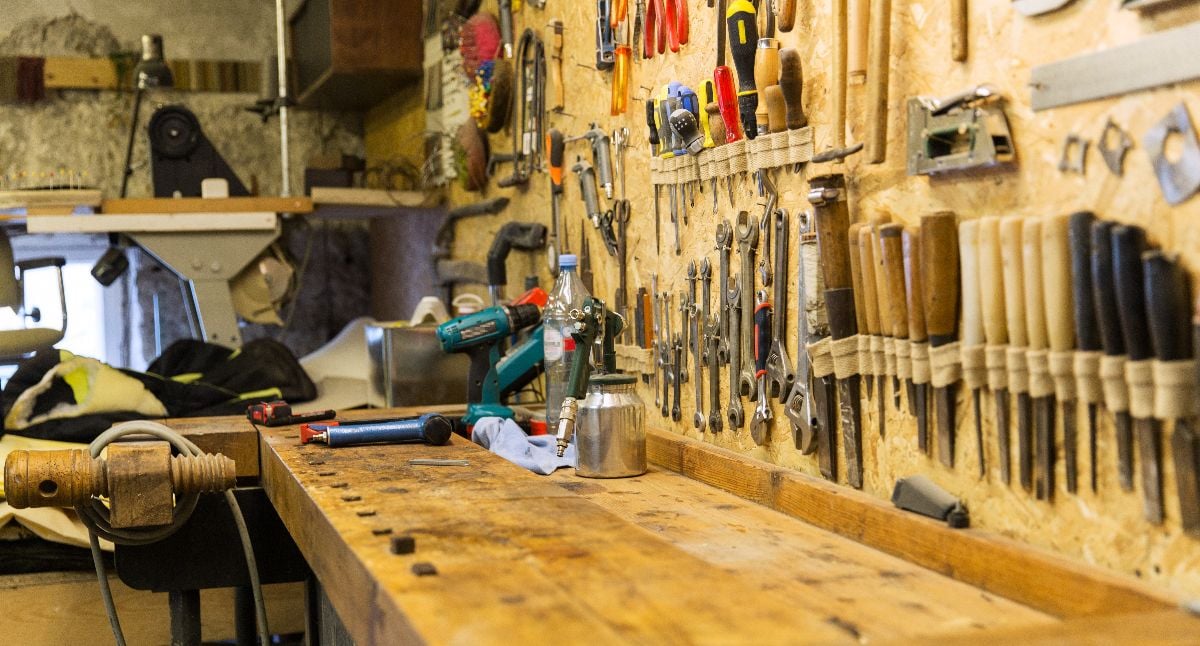 Work tools and workbench at workshop.