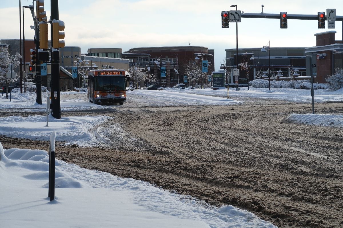 RTD Hop bus drives route through the snowy streets of Boulder.