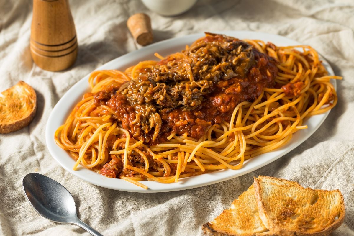 Homemade pulled pork barbecue spaghetti with meat sauce.