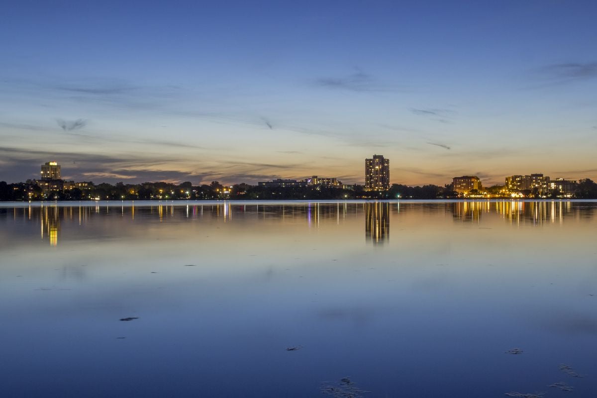 Vibrant reflections in Bde Maka Ska during a clear summer twilight.