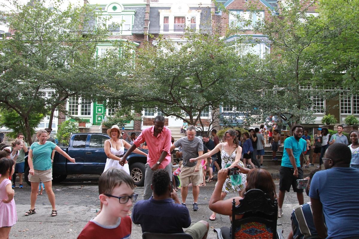 People dancing at a block party.
