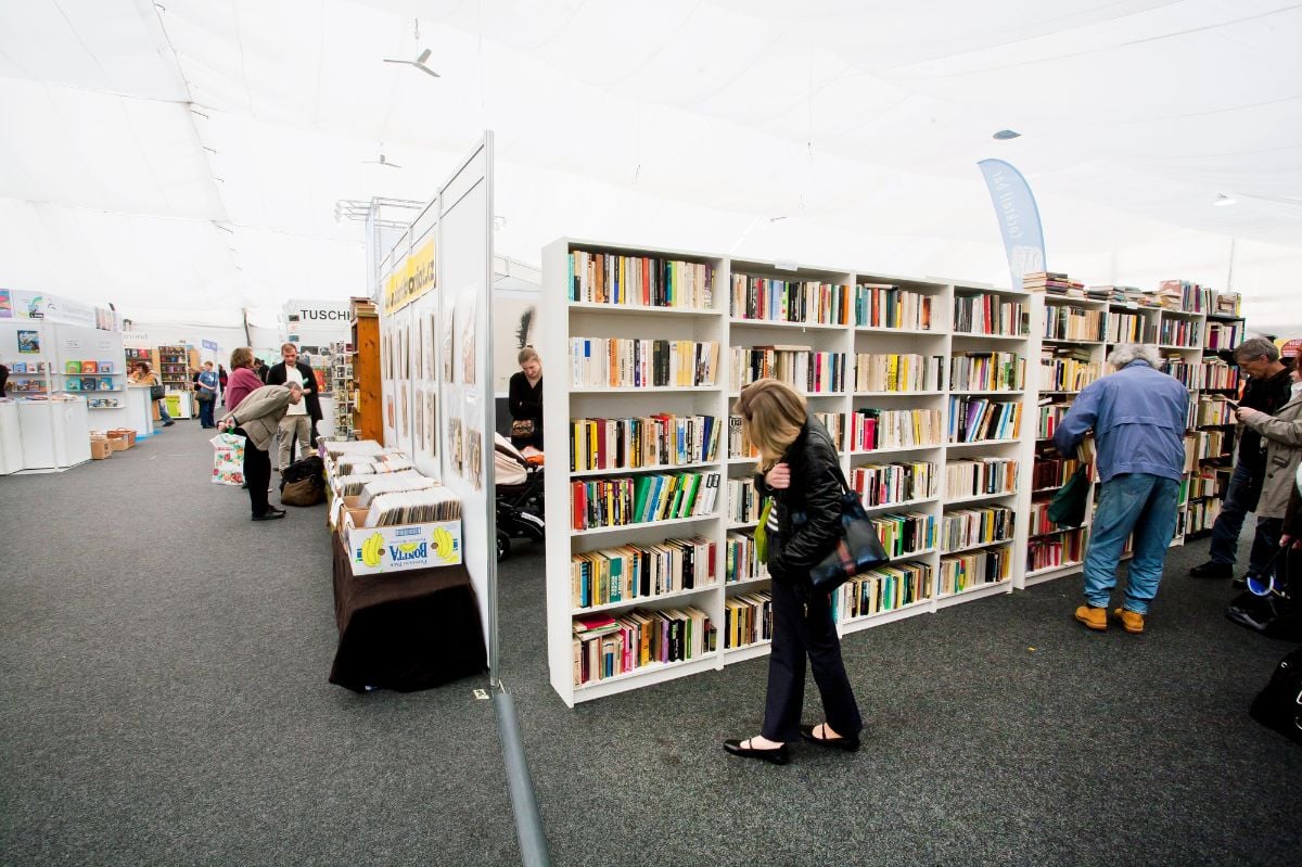 People browsing books at the indoor book market.