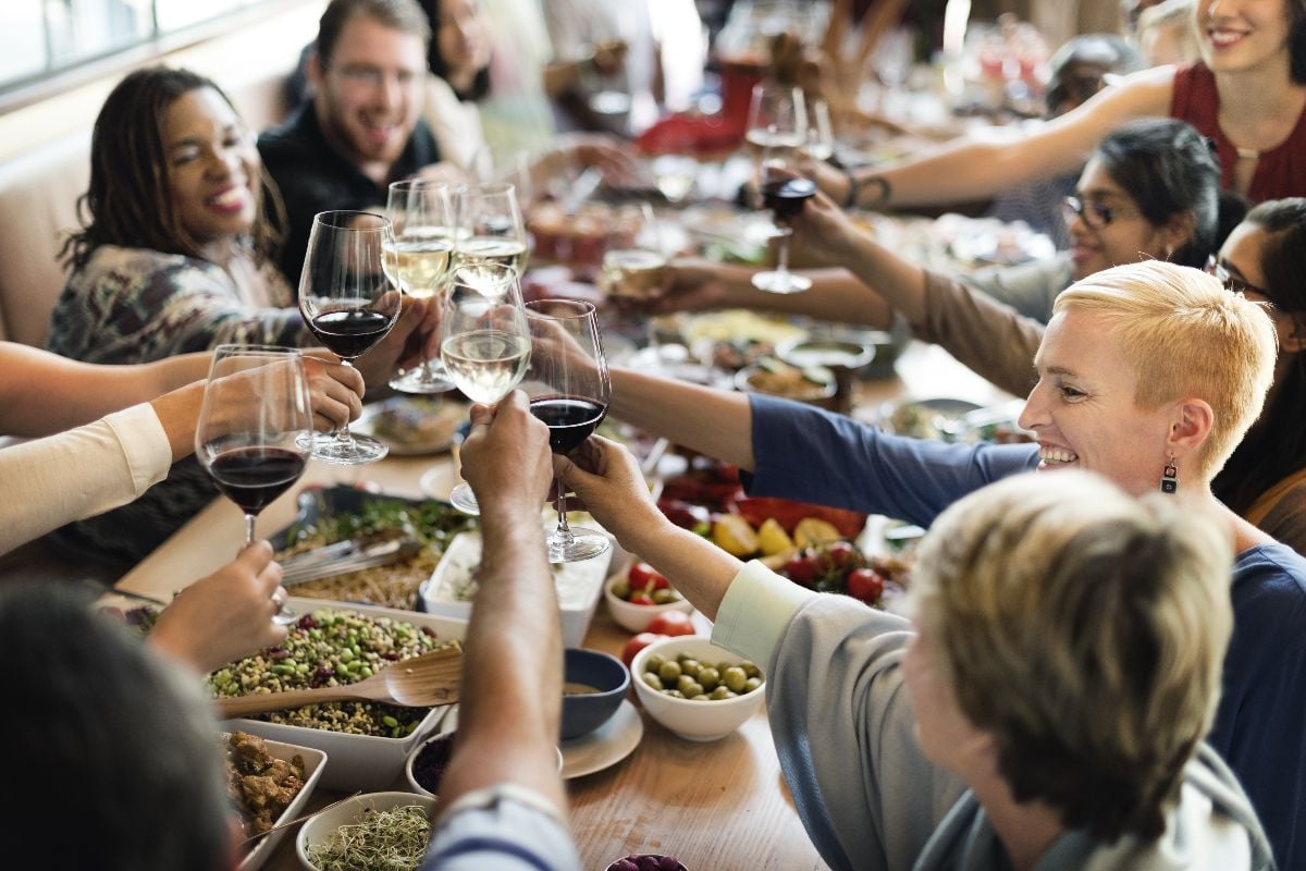 People enjoying brunch with wine.