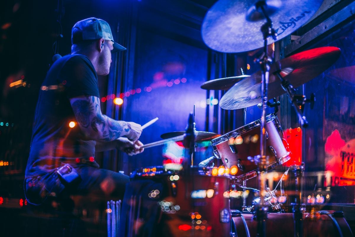 Band performing on stage in a Honky-tonk on Lower Broadway at night.