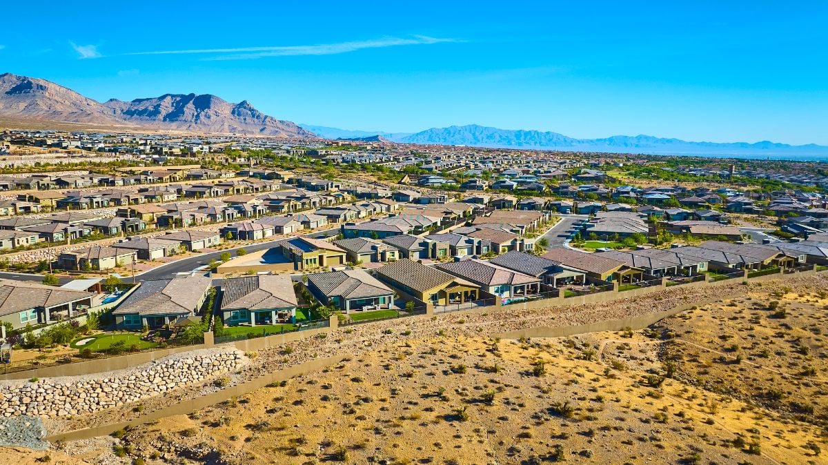 A sprawling suburban neighborhood against the backdrop of Red Rock Canyon.
