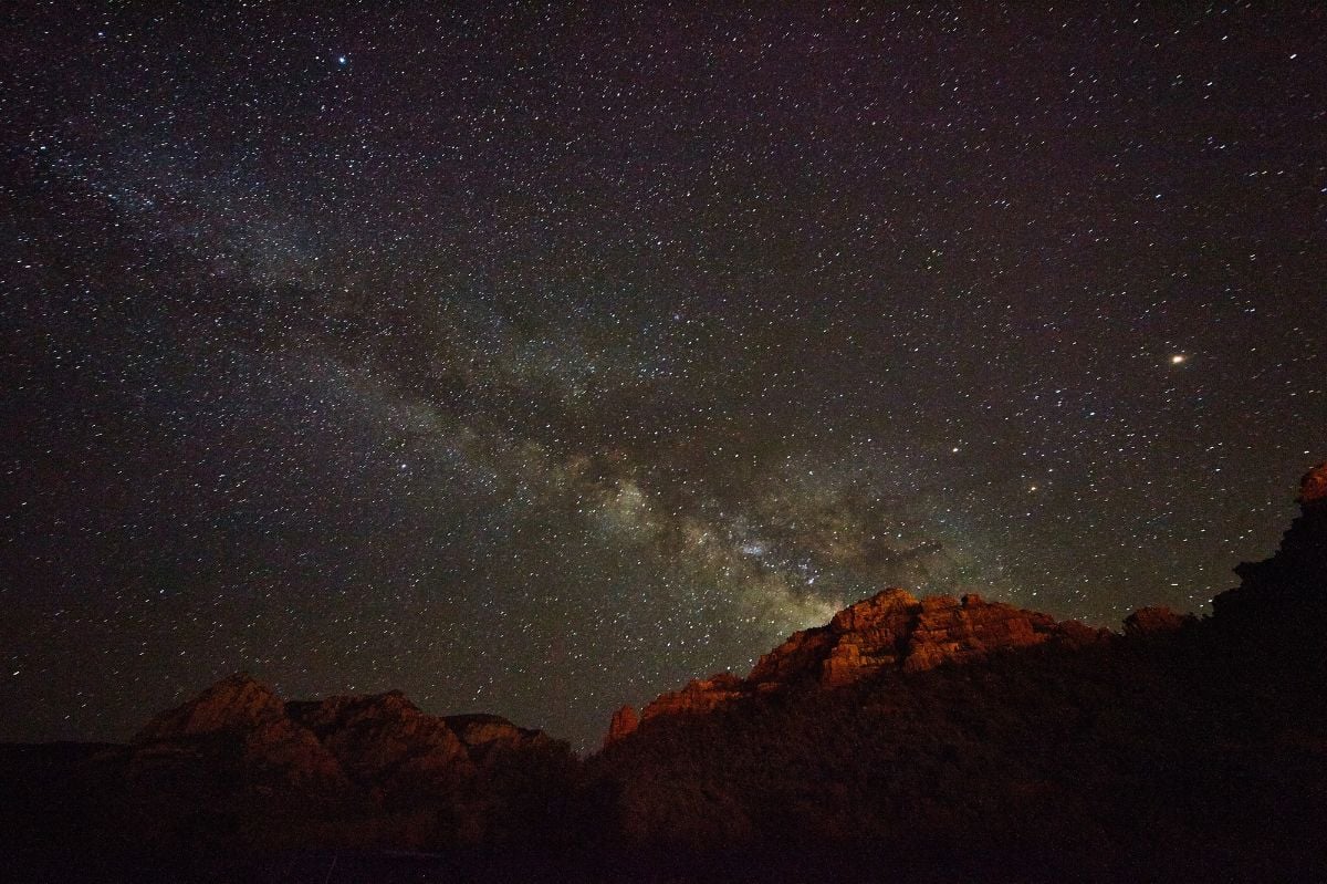 2016 Astrophotography of the starlit milky way over Sedona, Arizona terrain.