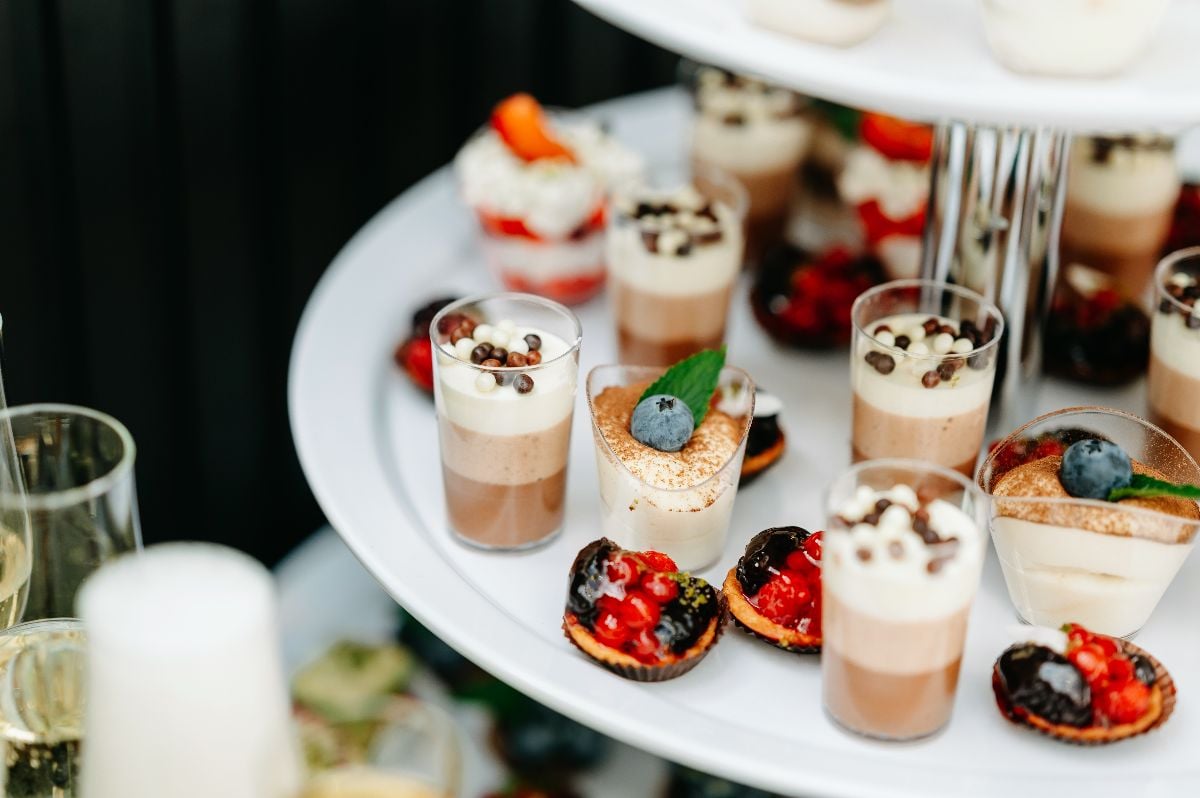 An elegant showcase of gourmet desserts arranged on tiers.