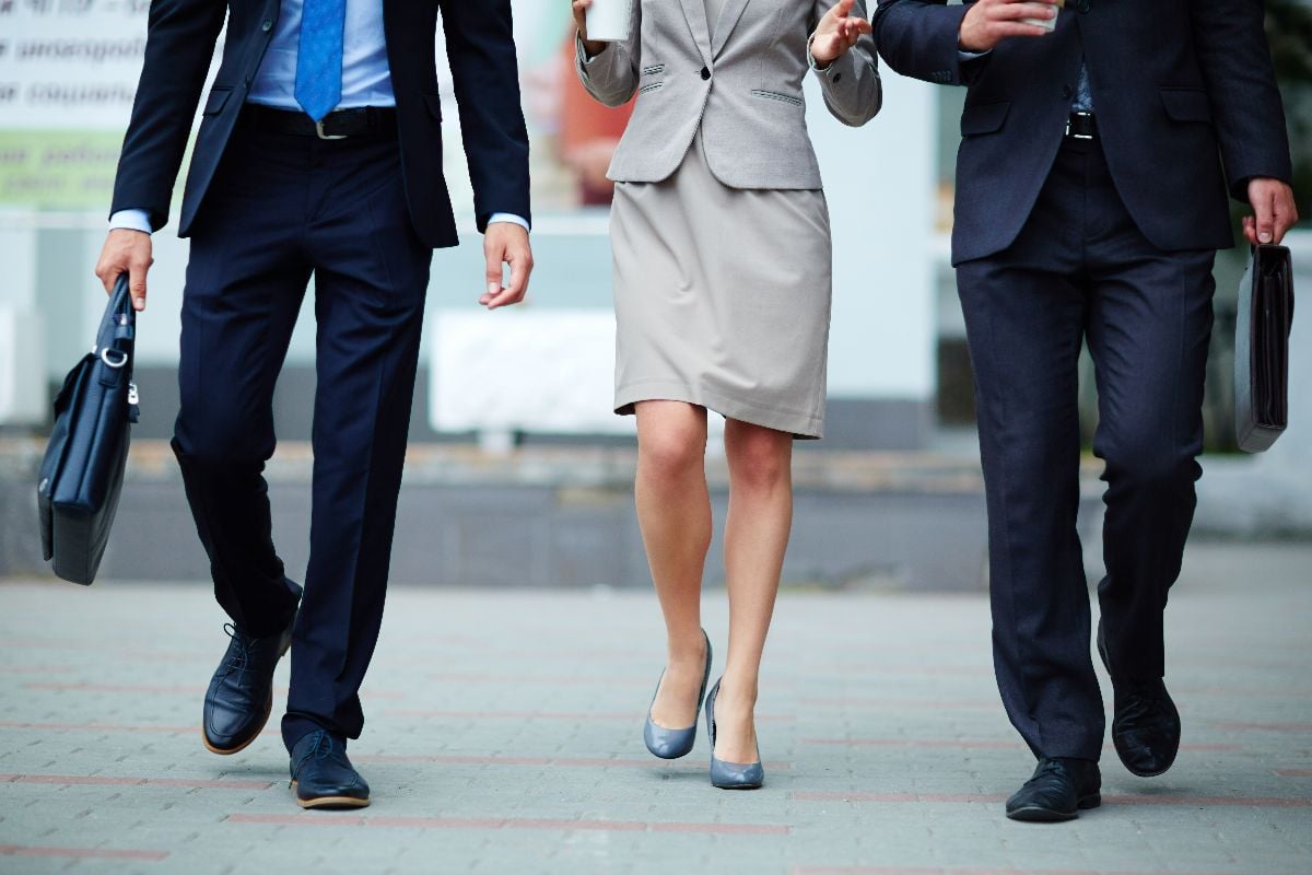 Closeup of business people legs wearing dress shoes.