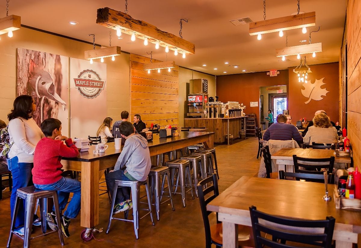 Customers eat breakfast at Maple Street Biscuit Company.