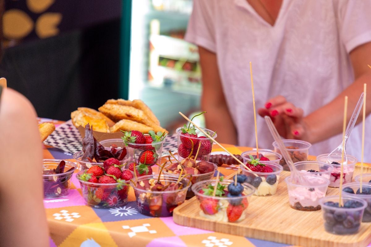 A variety of berries in clear bowls during the food festival.