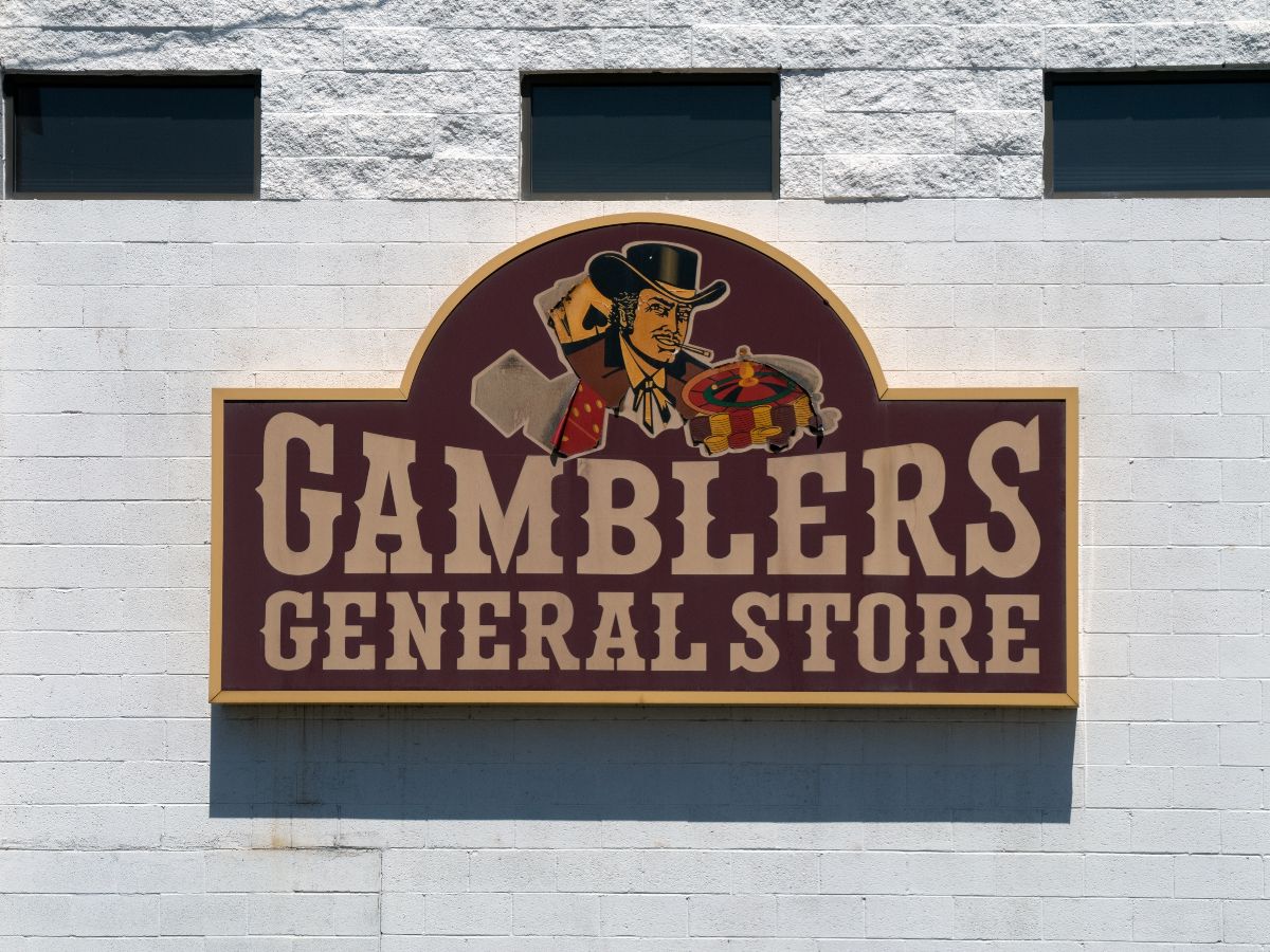 Sign on wall outside the Gamblers General Store on S main Street.