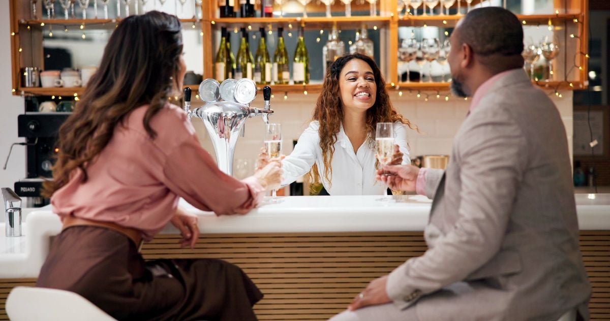 Business people celebrating at the bar.