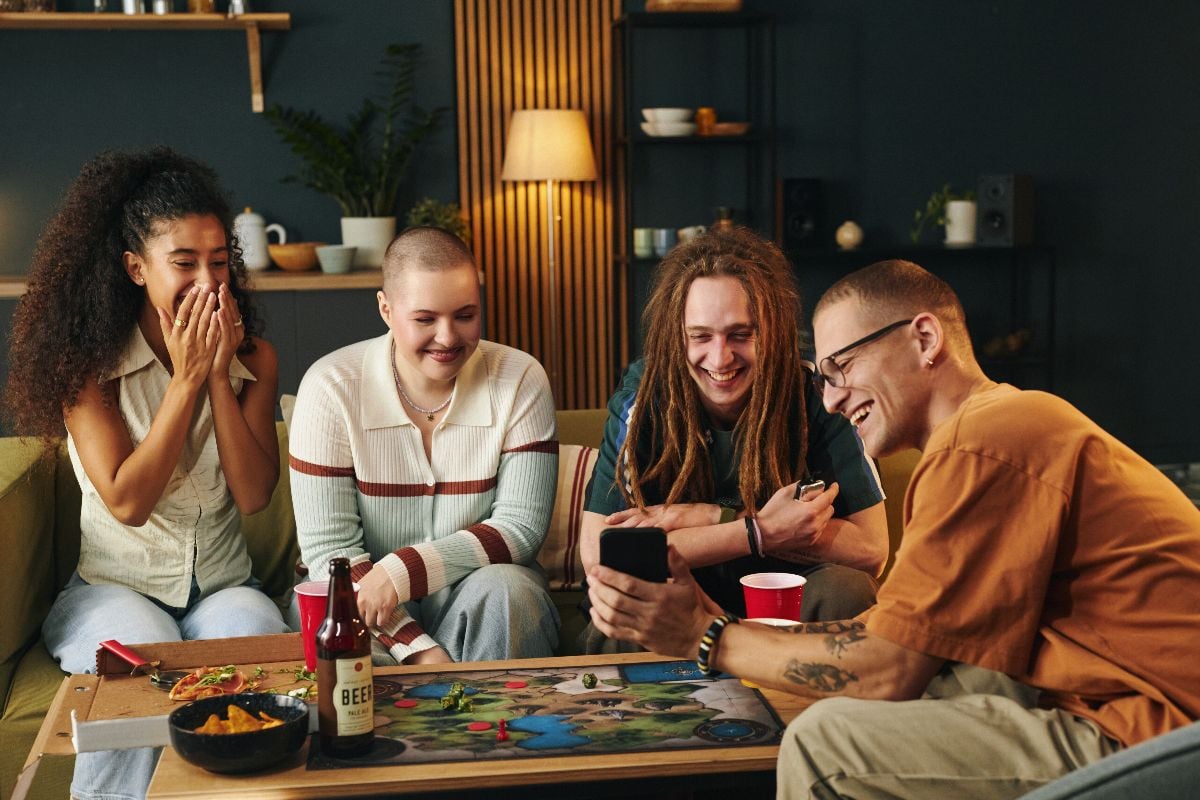 Friends enjoying game night in the living room.