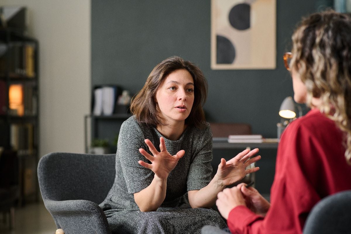 Two women engaging in deep conversation.
