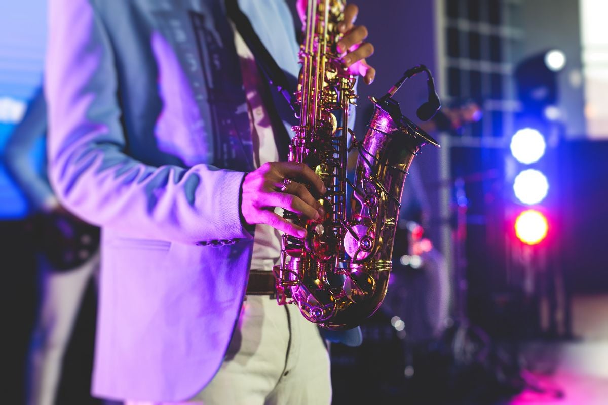 Concert view of saxophonist at night.