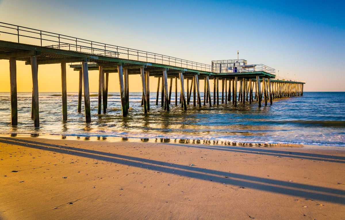 Fishing pier and the Atlantic Ocean at sunrise in Ventnor City, New Jersey.