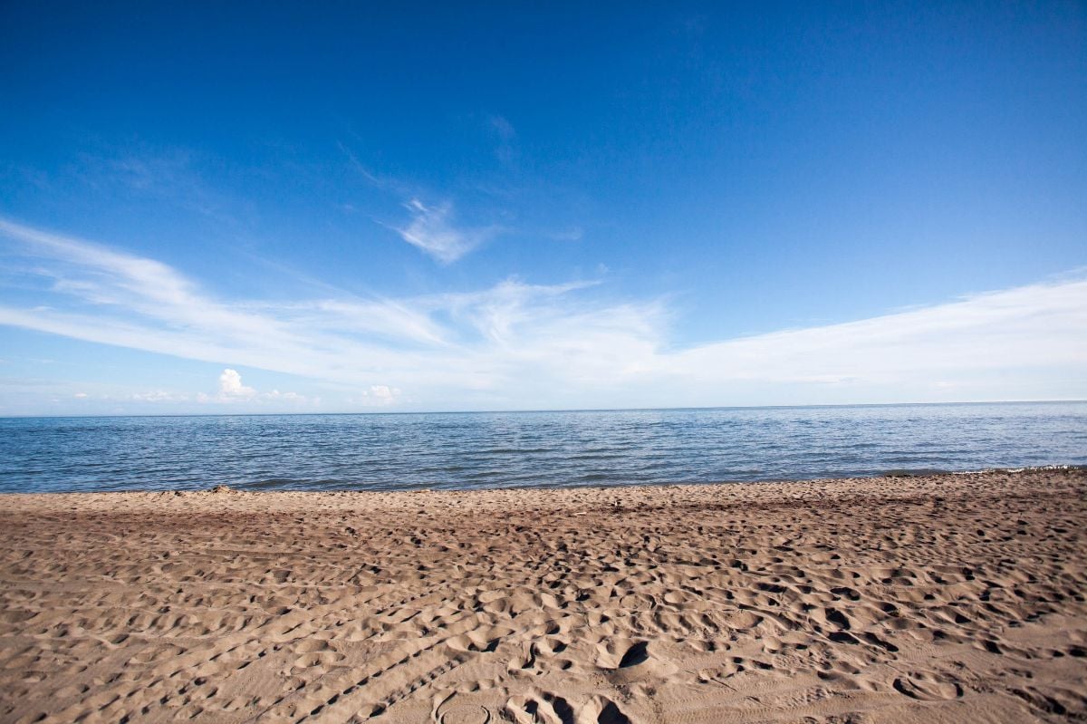 A sunny beach day on the shores of Lake Erie at Long Point Provincial Park.