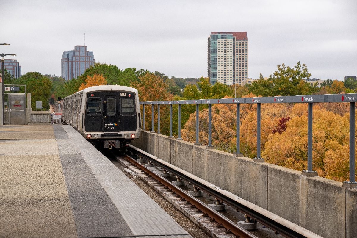 Marta trains and track at Dunwoody stop in fall season..