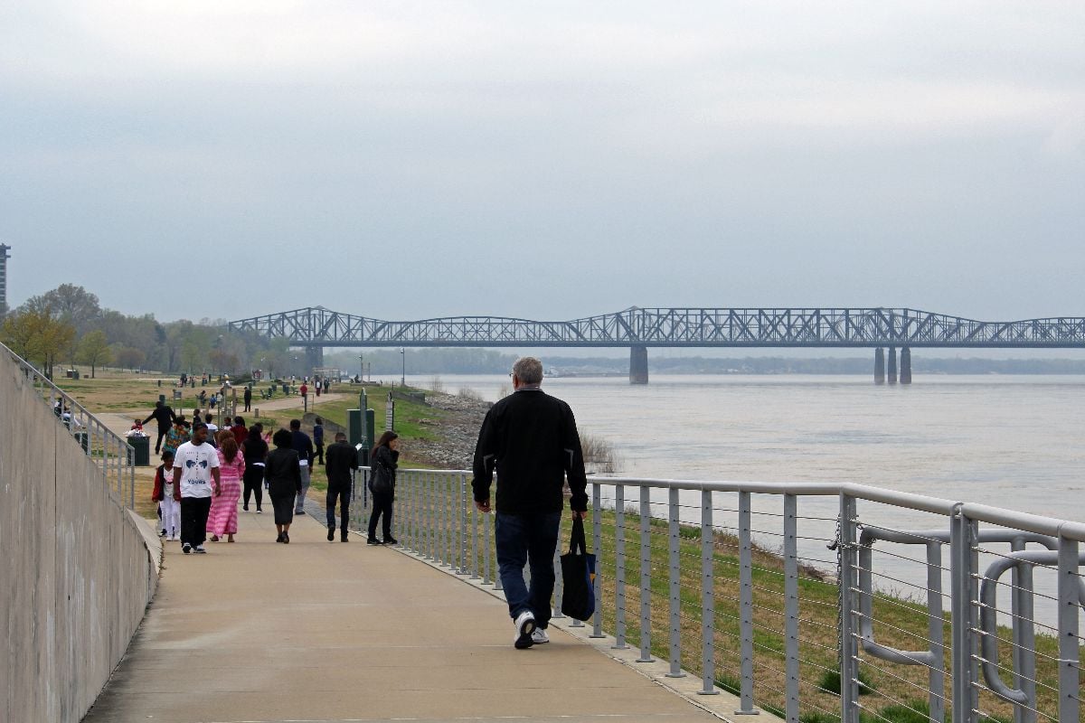 Tourists and residents walk on River Walk on Mississippi River in Memphis.