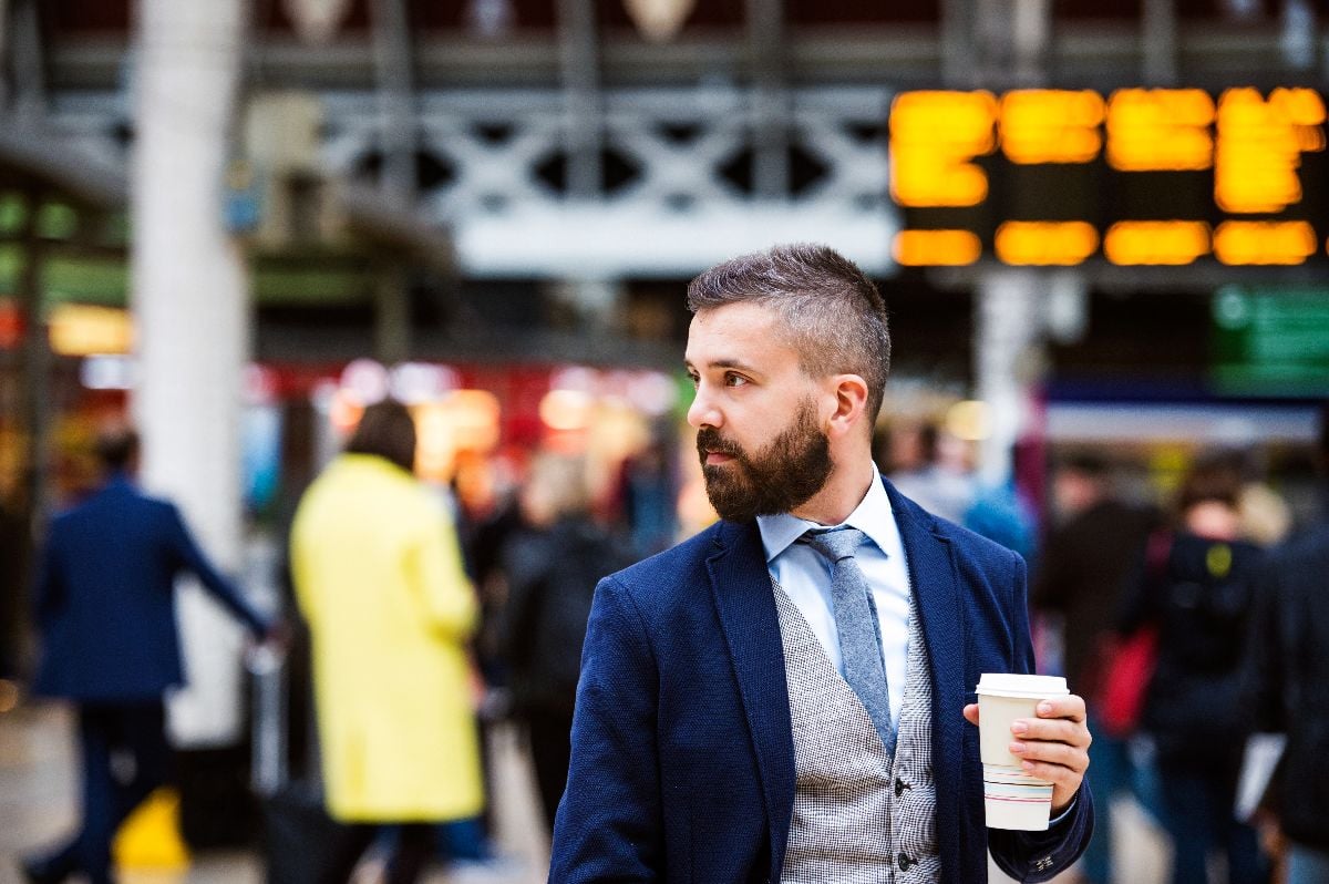 Young businessman with cup of coffee.