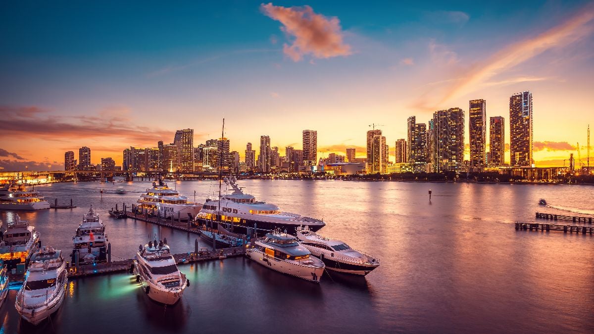 The skyline of Miami during sunset with a marina.