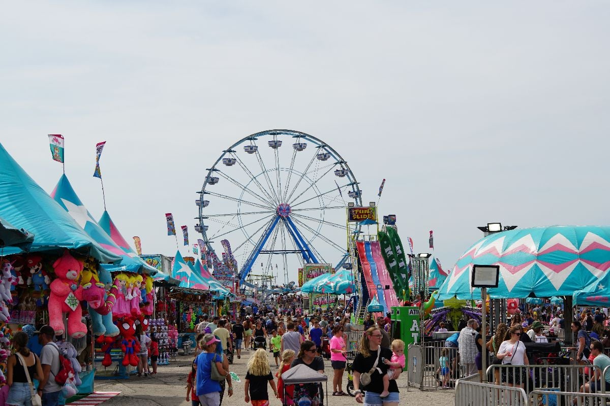 The crowded carnival midway at the Missouri State Fair.