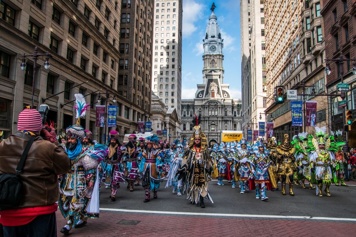 New Years Day Mummers Parade men in colorful costumes strut and perform on Broad Street.