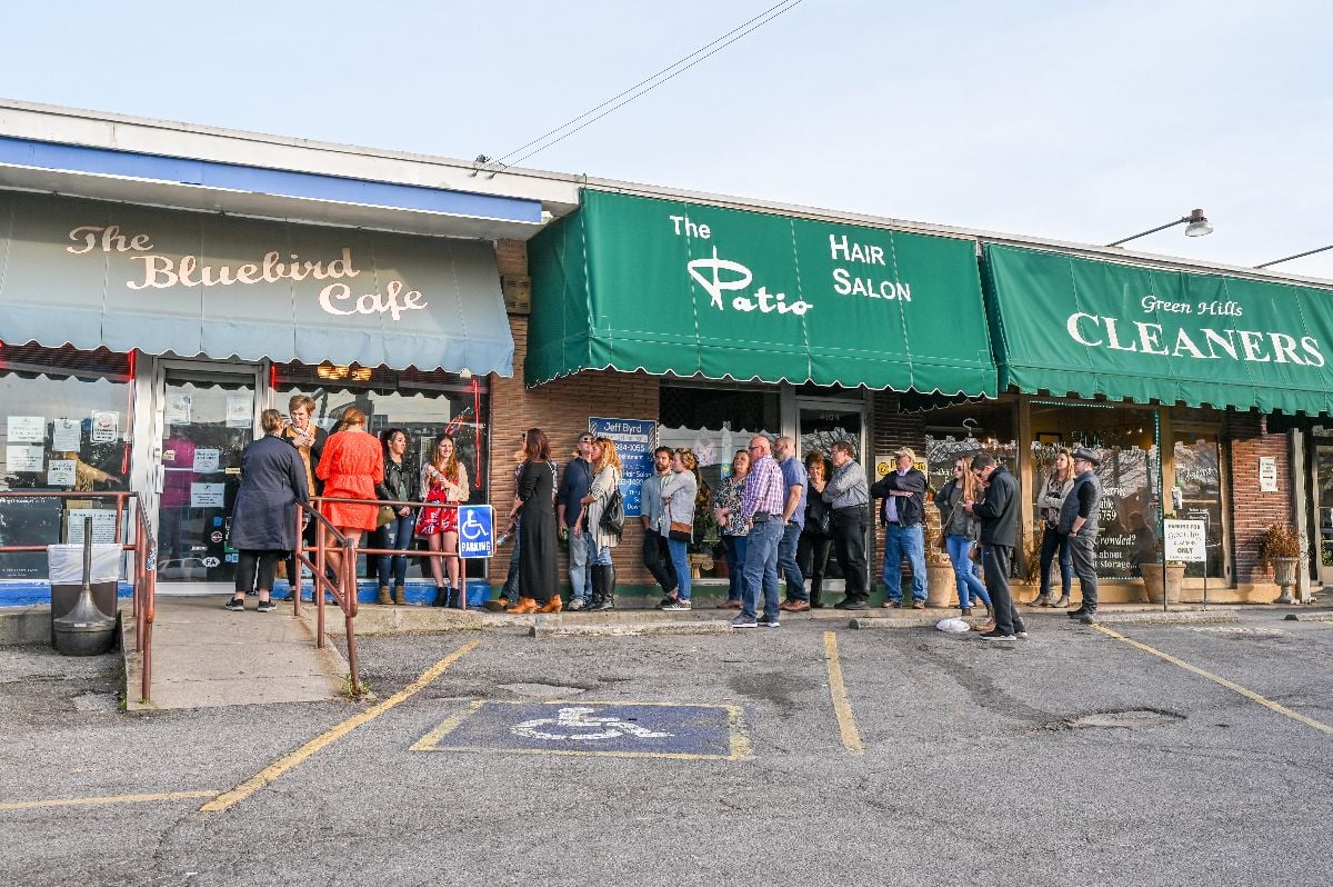 People queue outside world famous Bluebird Cafe.