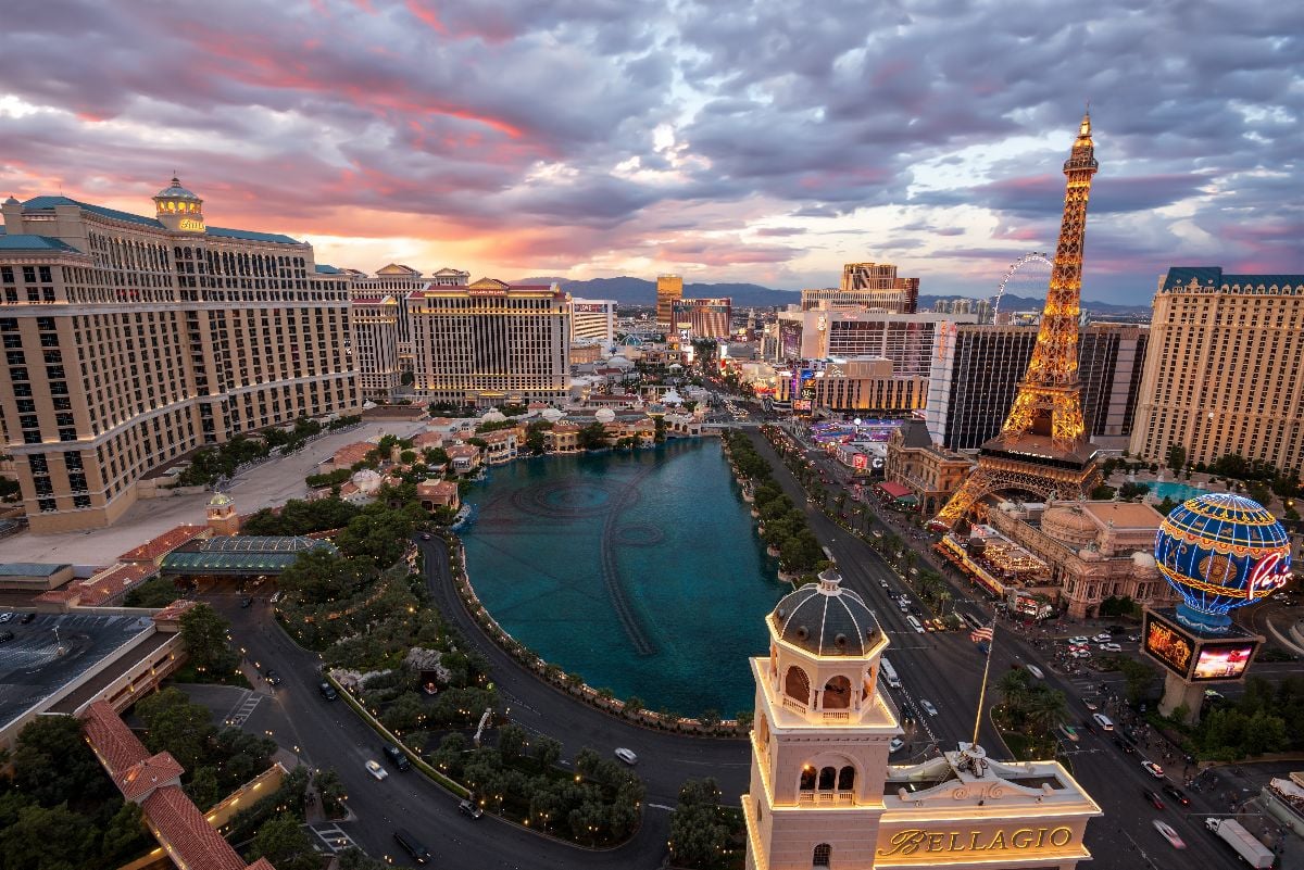 Las Vegas panoramic skyline view of the famous strip with the Bellagio Fountains at sunset.