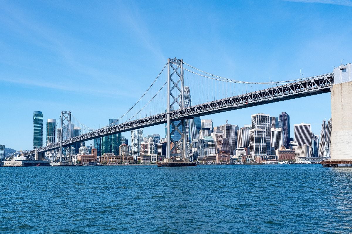 The Oakland Bay Bridge and the downtown San Francisco skyline.
