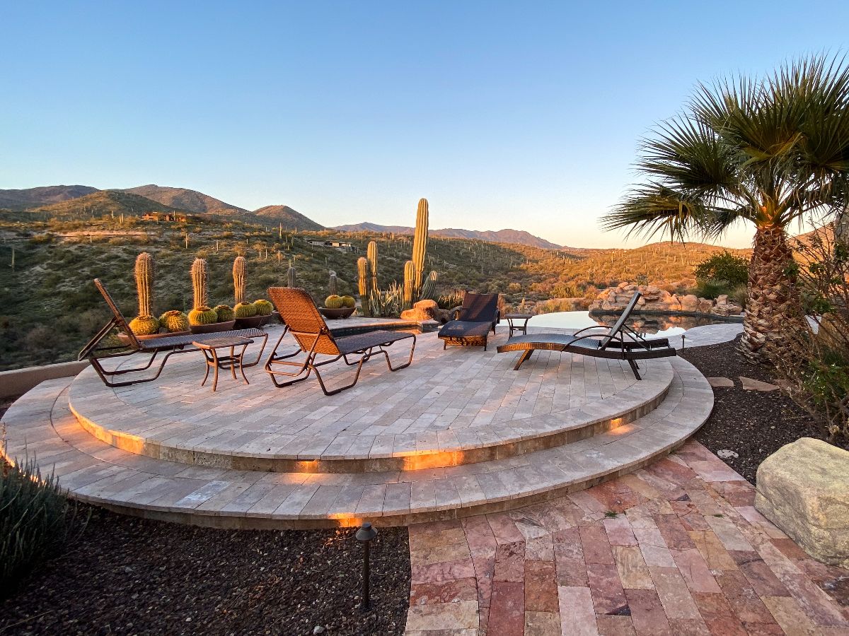 Outdoor pool overlooking desert mountains.