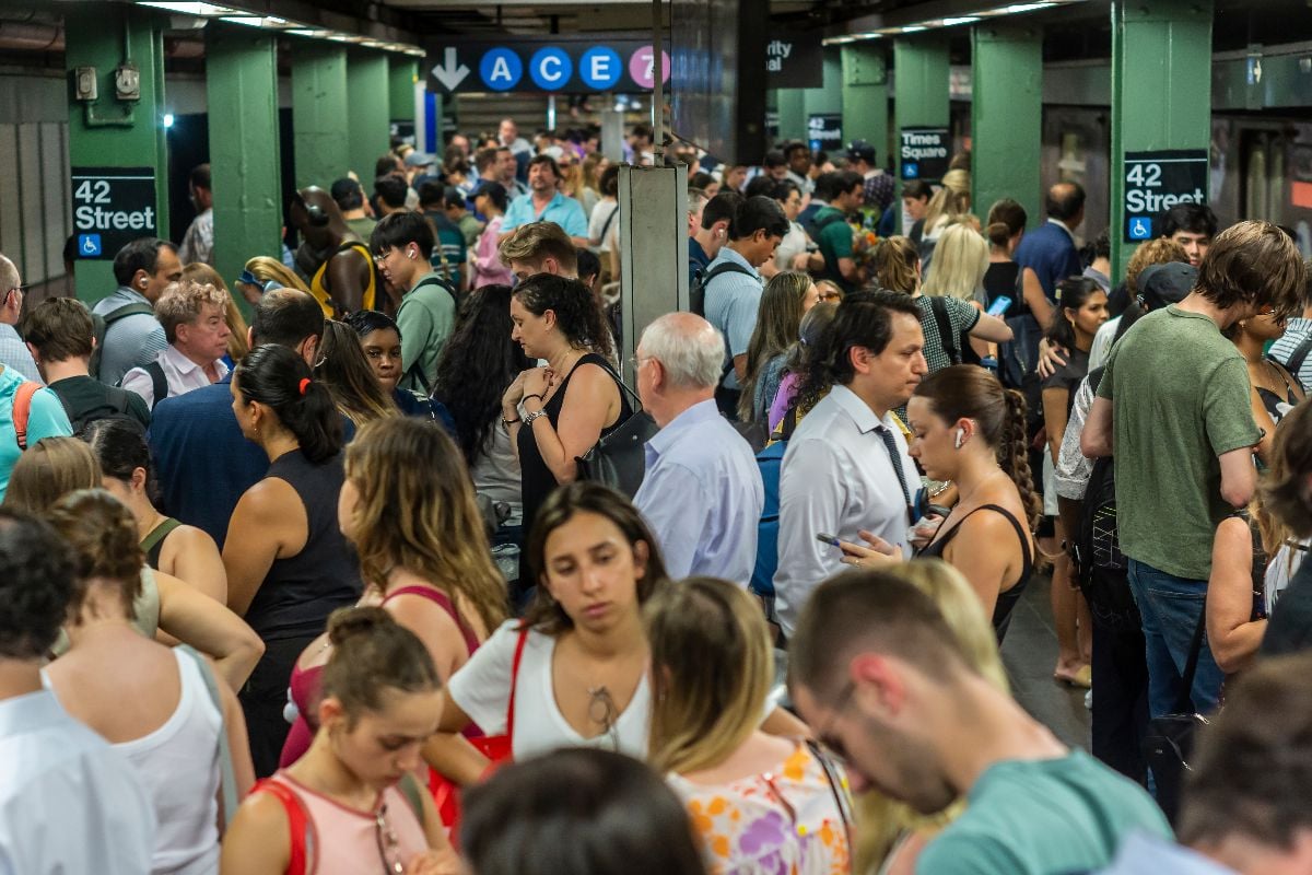Crowded subway during a delay.