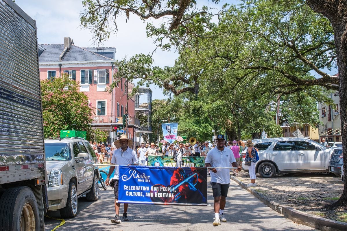 Parade celebrating Satchmo Summerfest moves down Esplanade Avenue in the French Quarter.